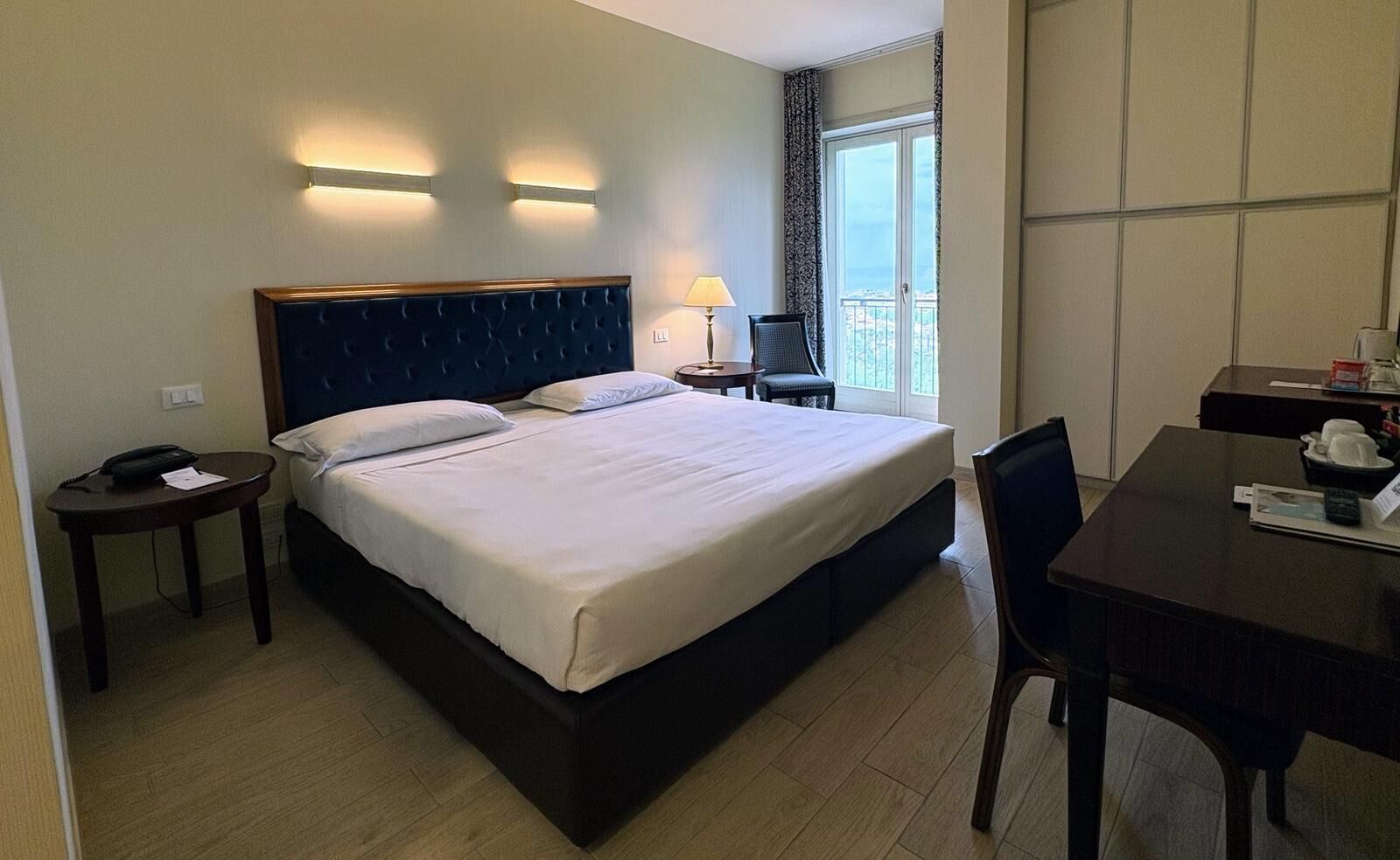 Superior Room | Minibar, in-room safe, laptop workspace, iron/ironing board