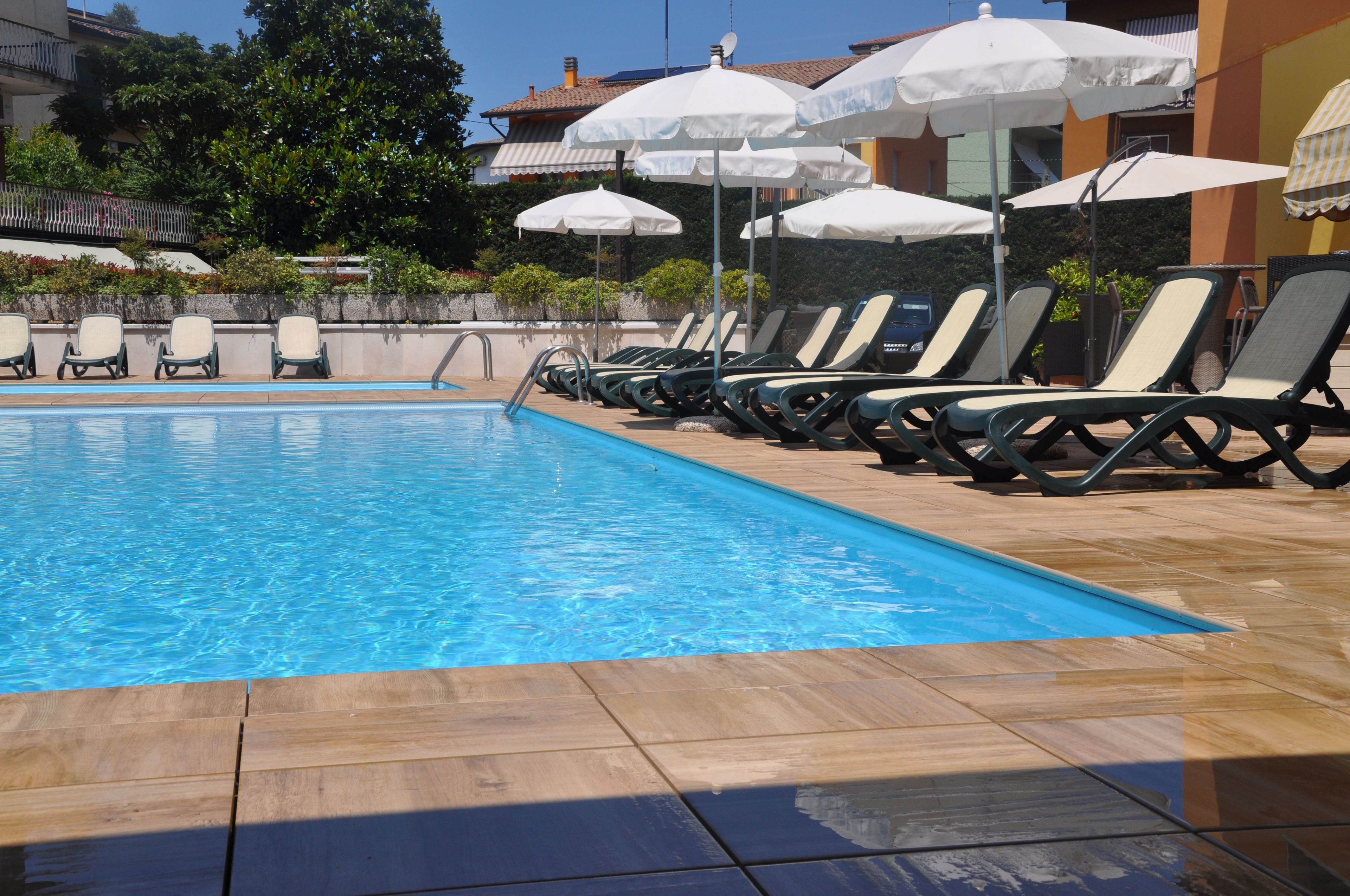 seasonal outdoor pool, open 8:30 am to 7:30 pm, pool umbrellas