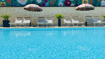 Seasonal outdoor pool, pool umbrellas, pool loungers