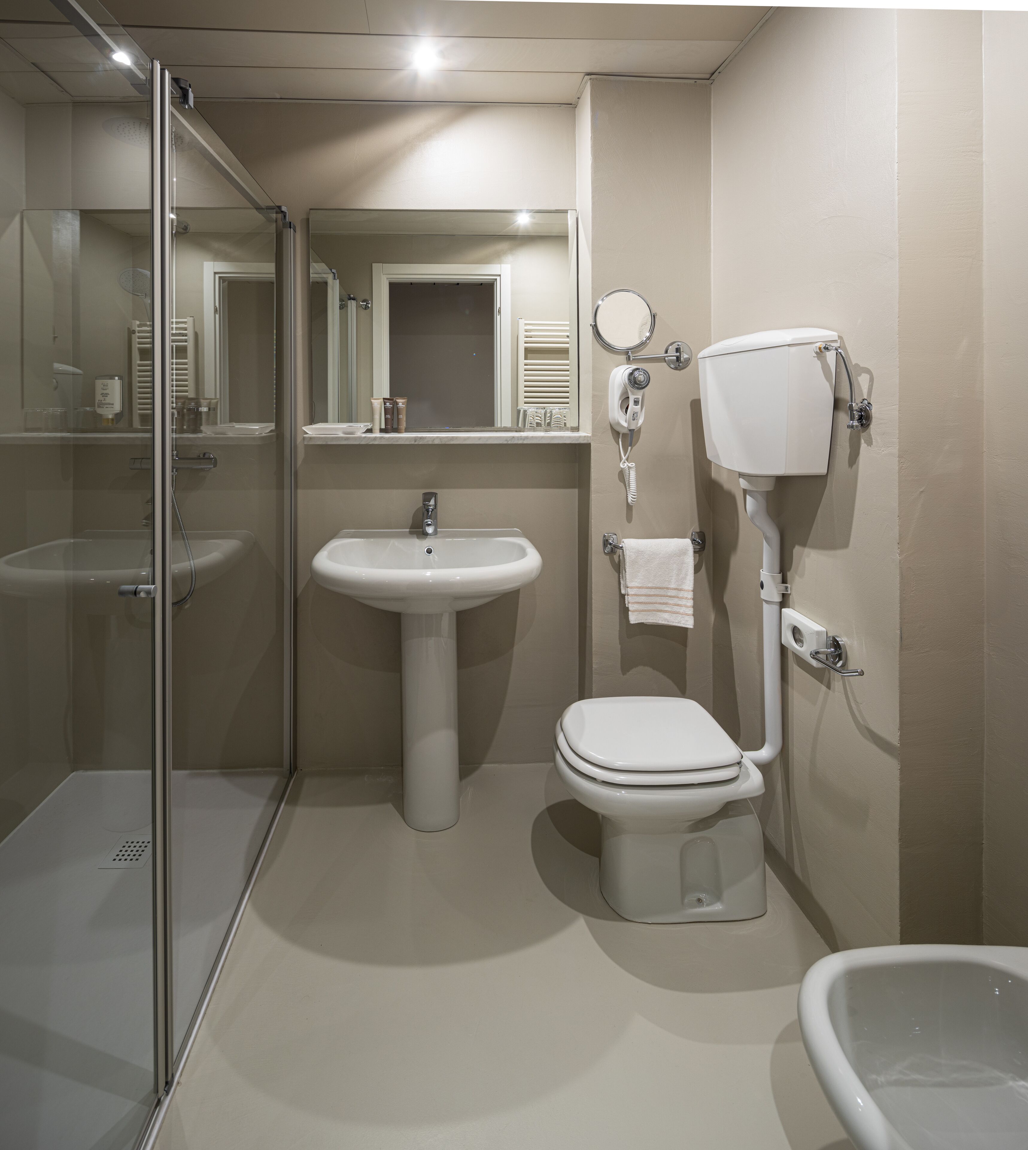 free toiletries, hair dryer, slippers, bidet