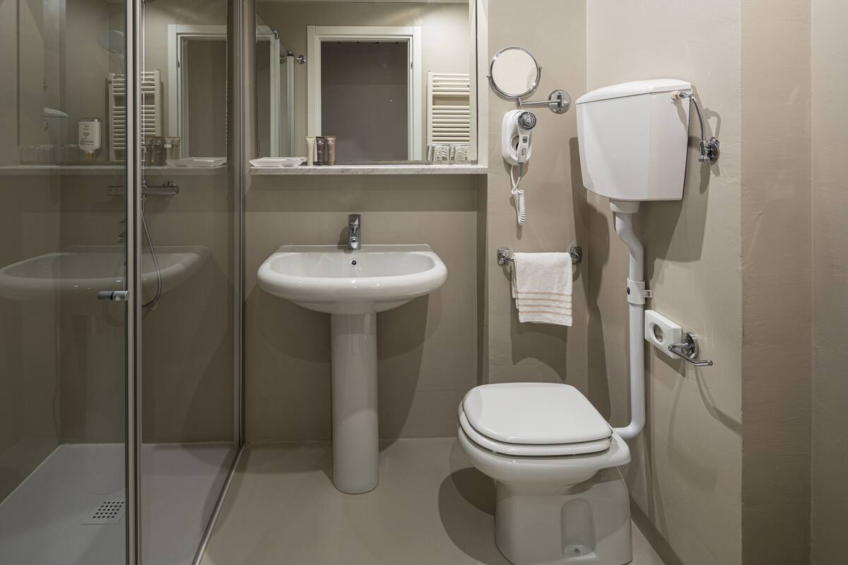 free toiletries, hair dryer, slippers, bidet