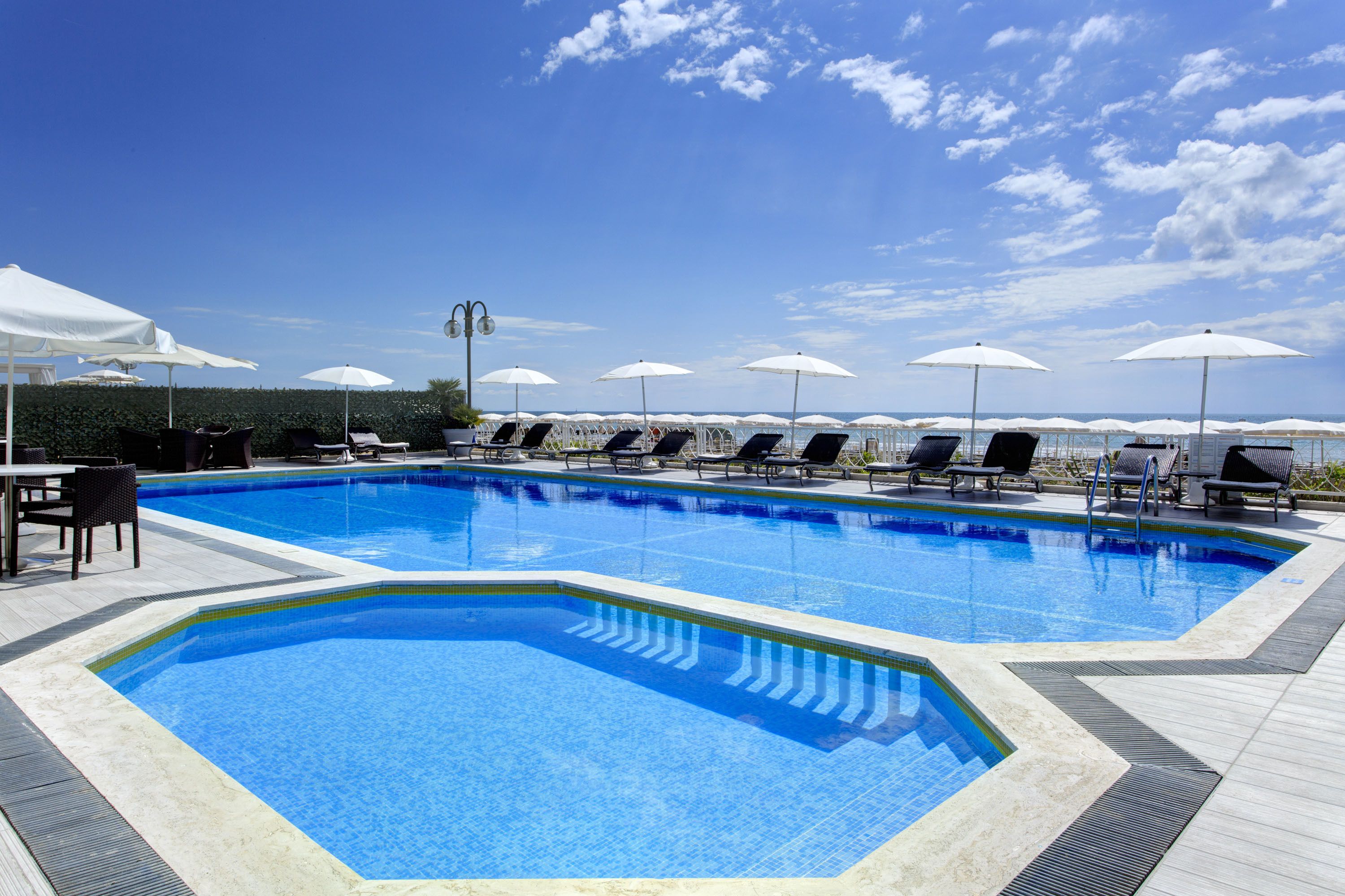 Outdoor pool, open 9:00 AM to 6:00 PM, pool umbrellas, sun loungers
