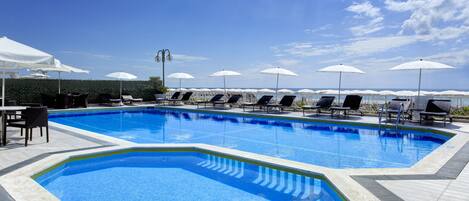 Outdoor pool, open 9:00 AM to 6:00 PM, pool umbrellas, sun loungers