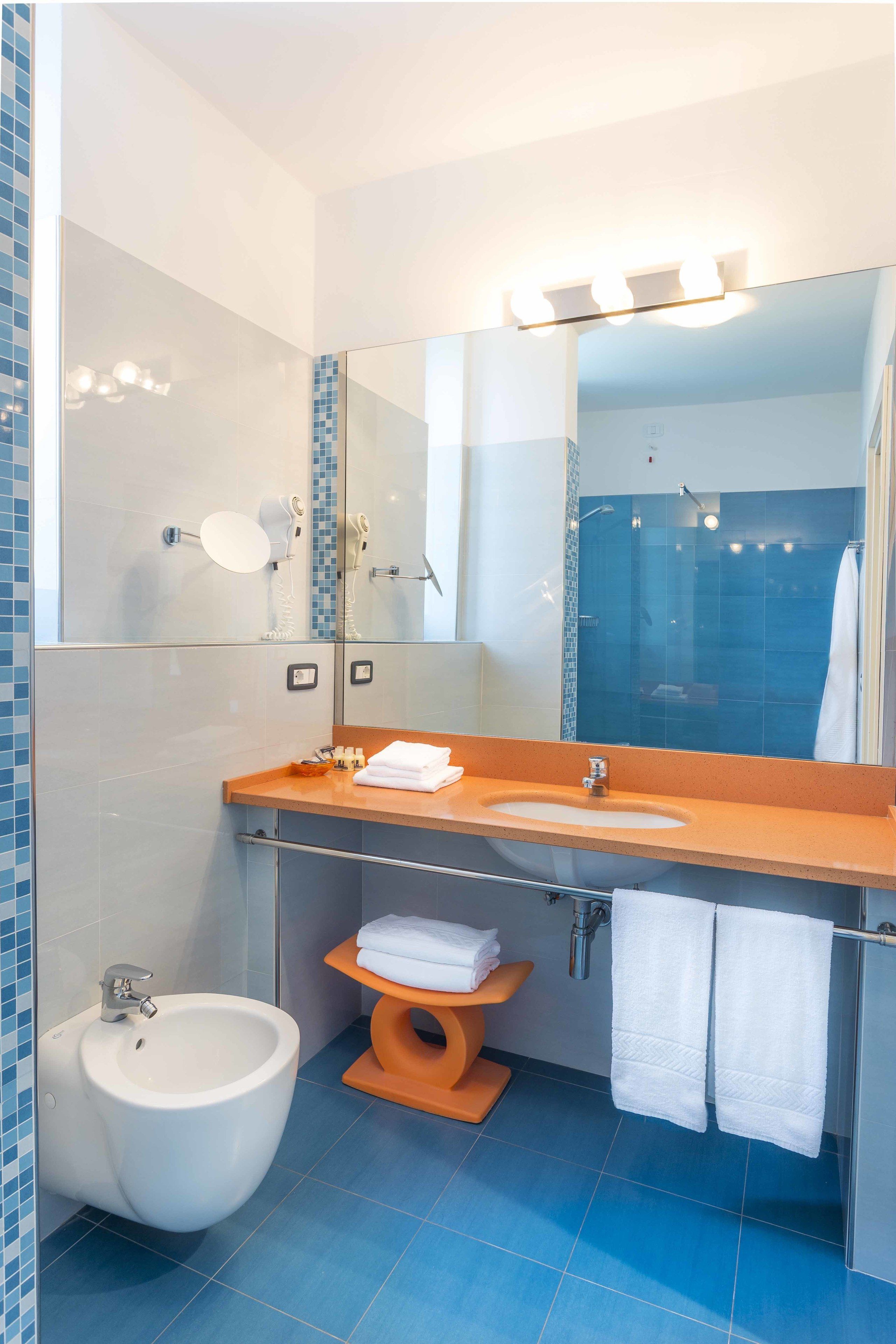 superior room | bathroom | shower, hair dryer, towels