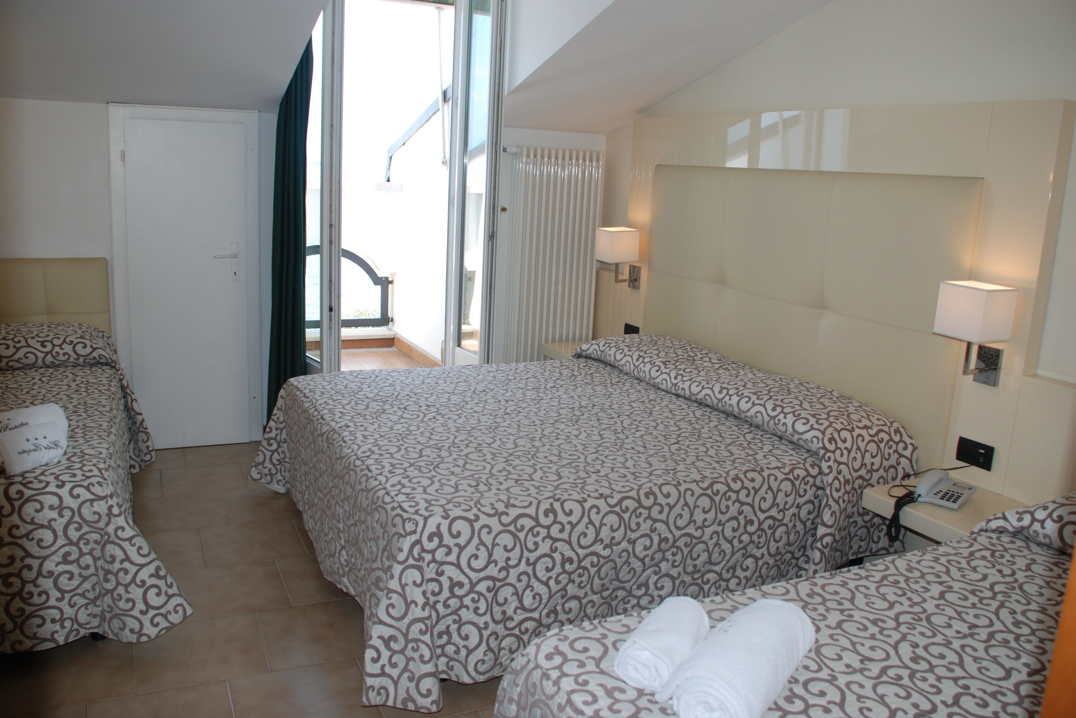 comfort quadruple room, lake view | frette italian sheets, premium bedding, down duvets, memory-foam beds