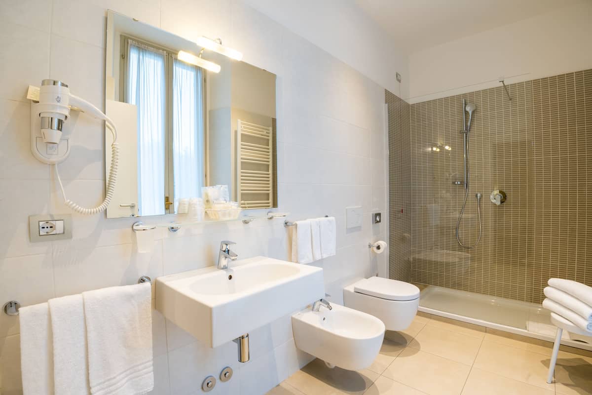 superior triple room (no elevator) | bathroom | shower, rainfall showerhead, eco-friendly toiletries, hair dryer