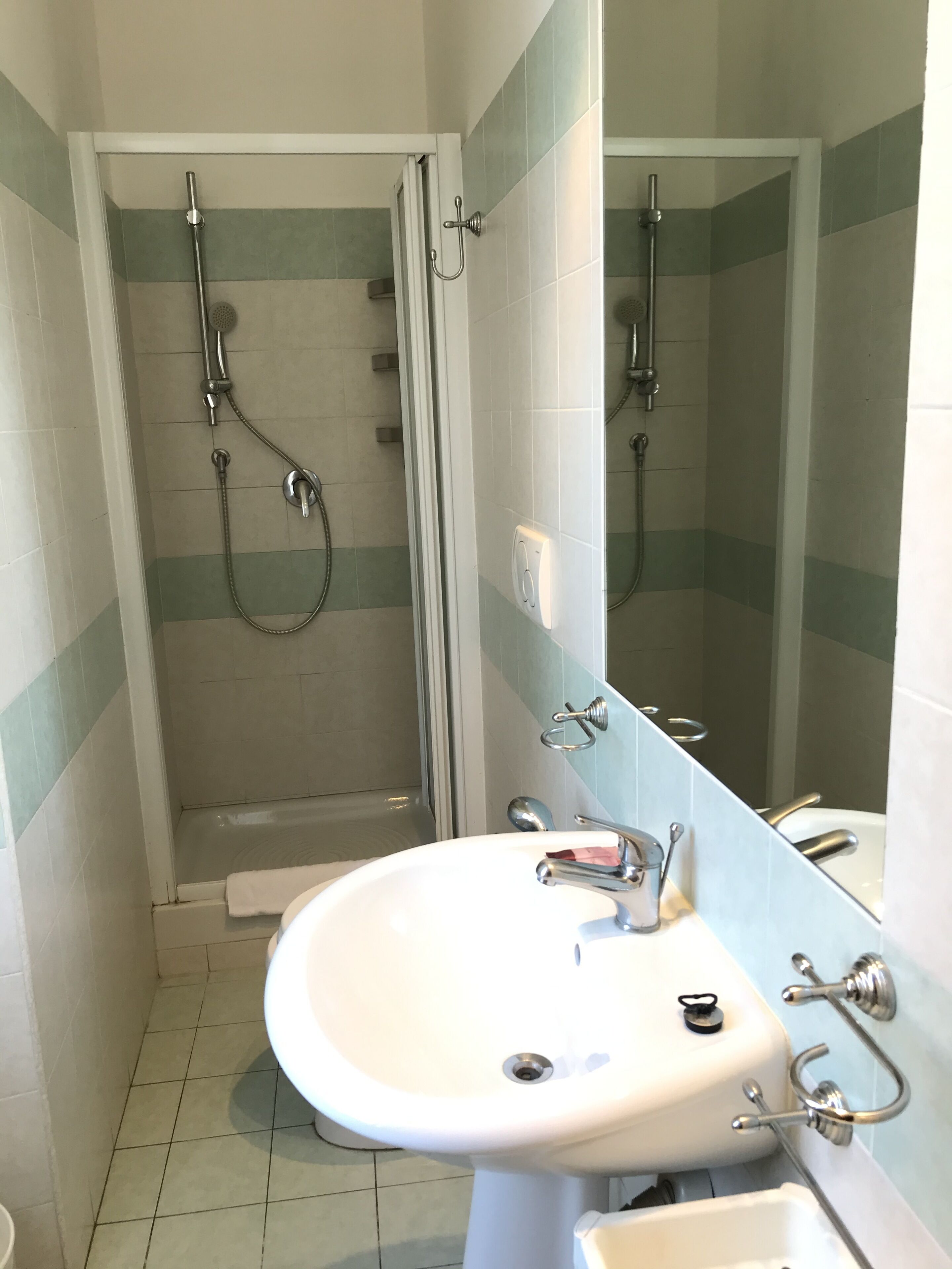 quadruple room | bathroom | shower, hair dryer, towels, soap