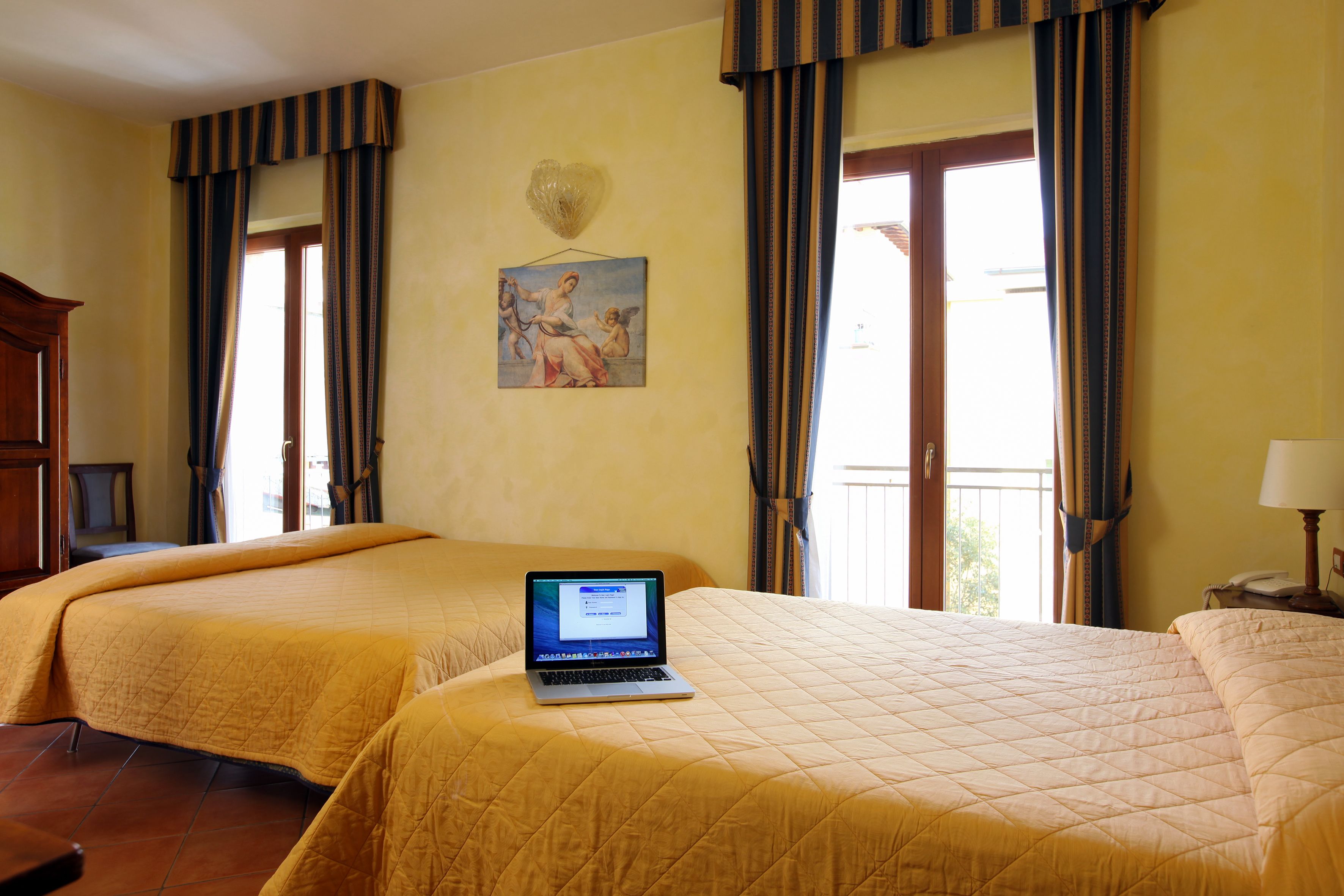 quadruple room | minibar, in-room safe, desk, laptop workspace