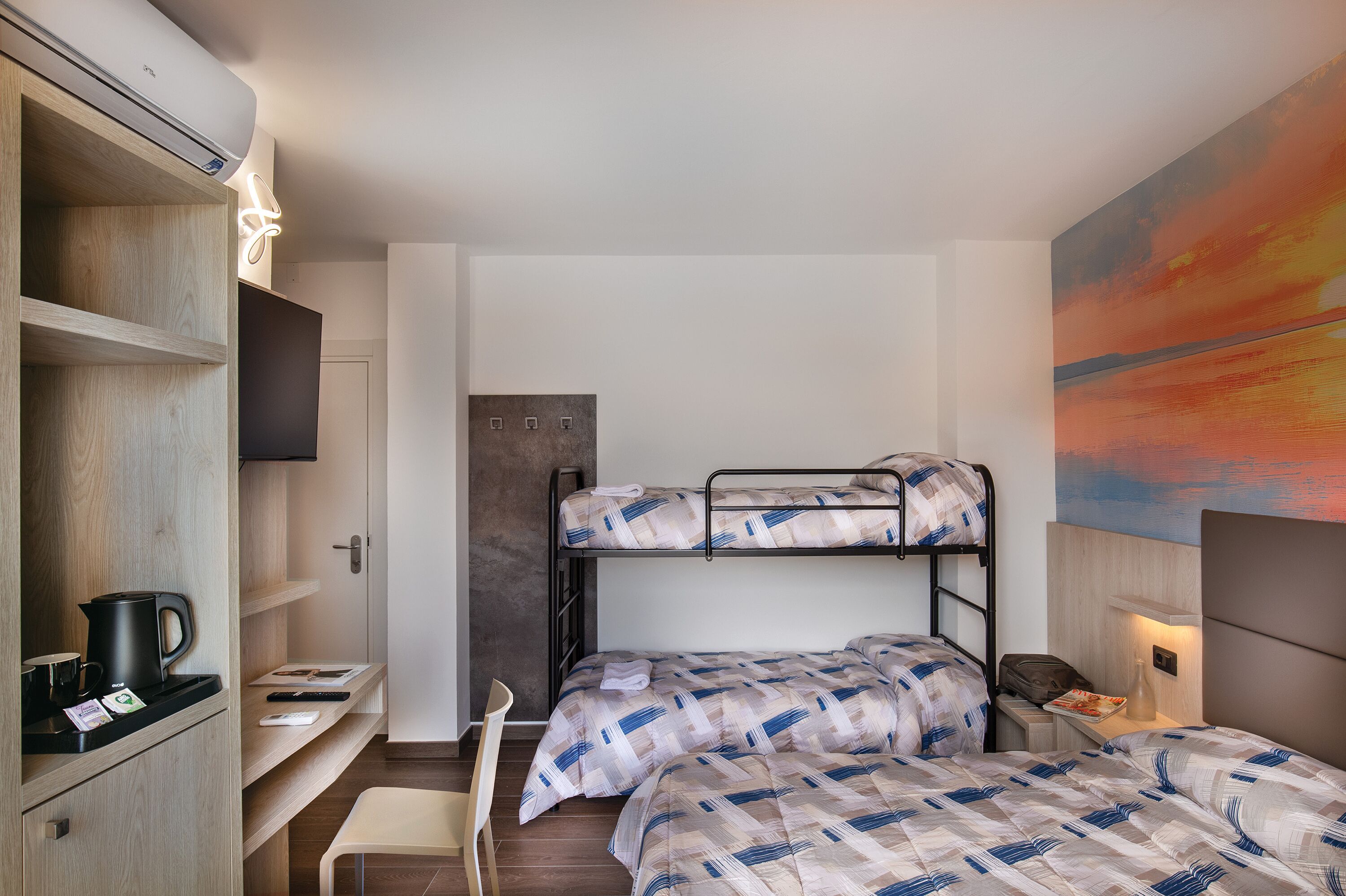 Superior Quadruple Room | Minibar, in-room safe, desk, laptop workspace