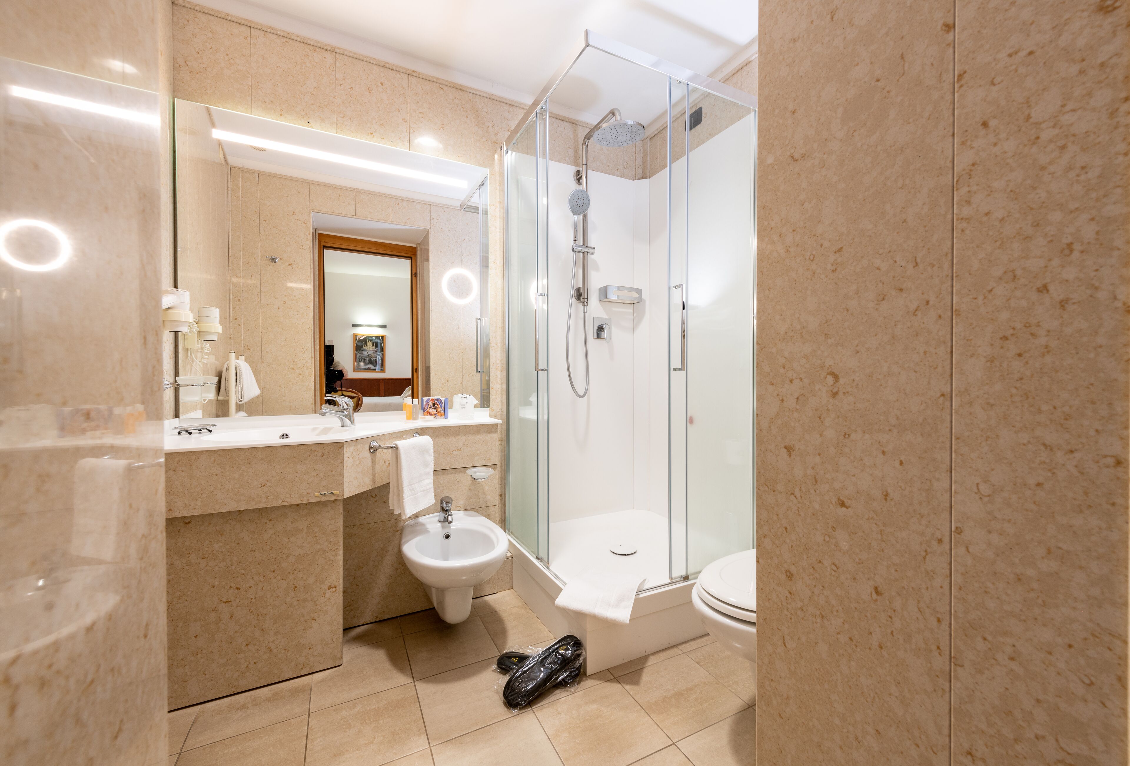 junior suite | bathroom | combined shower/bathtub, rainfall showerhead, designer toiletries