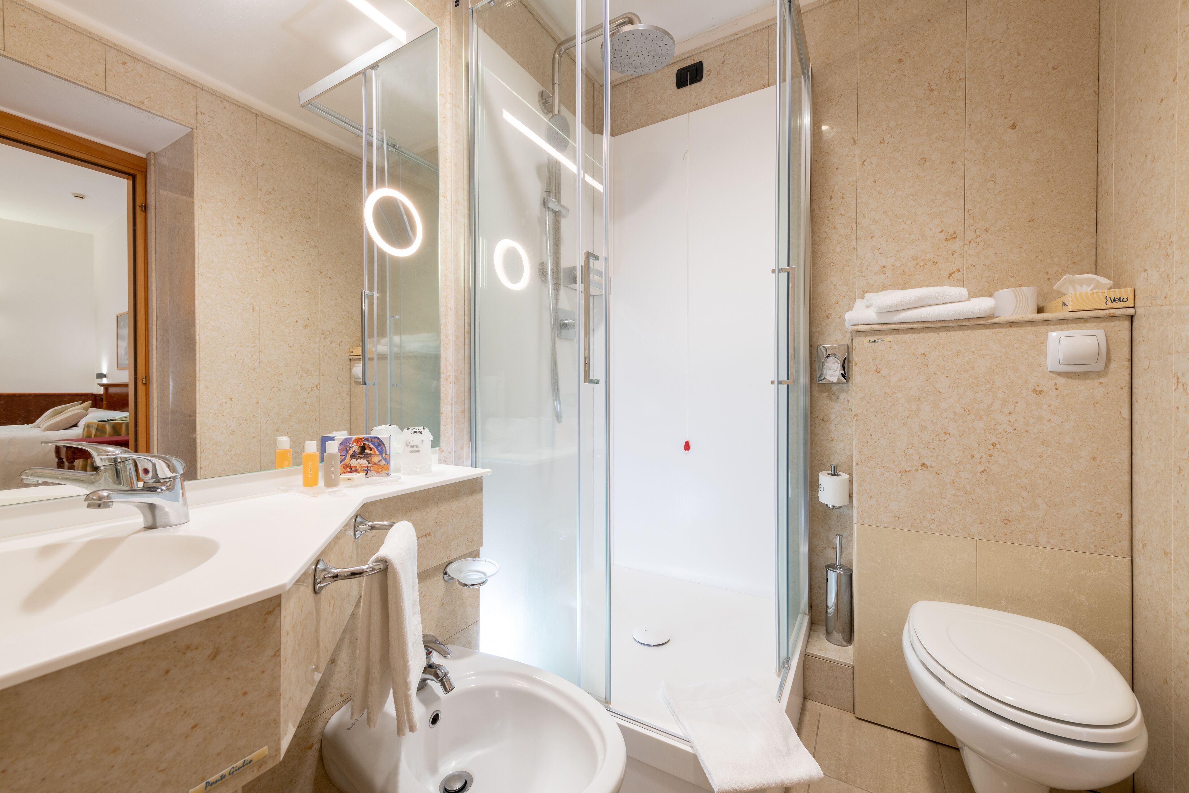 junior suite | bathroom | combined shower/bathtub, rainfall showerhead, designer toiletries