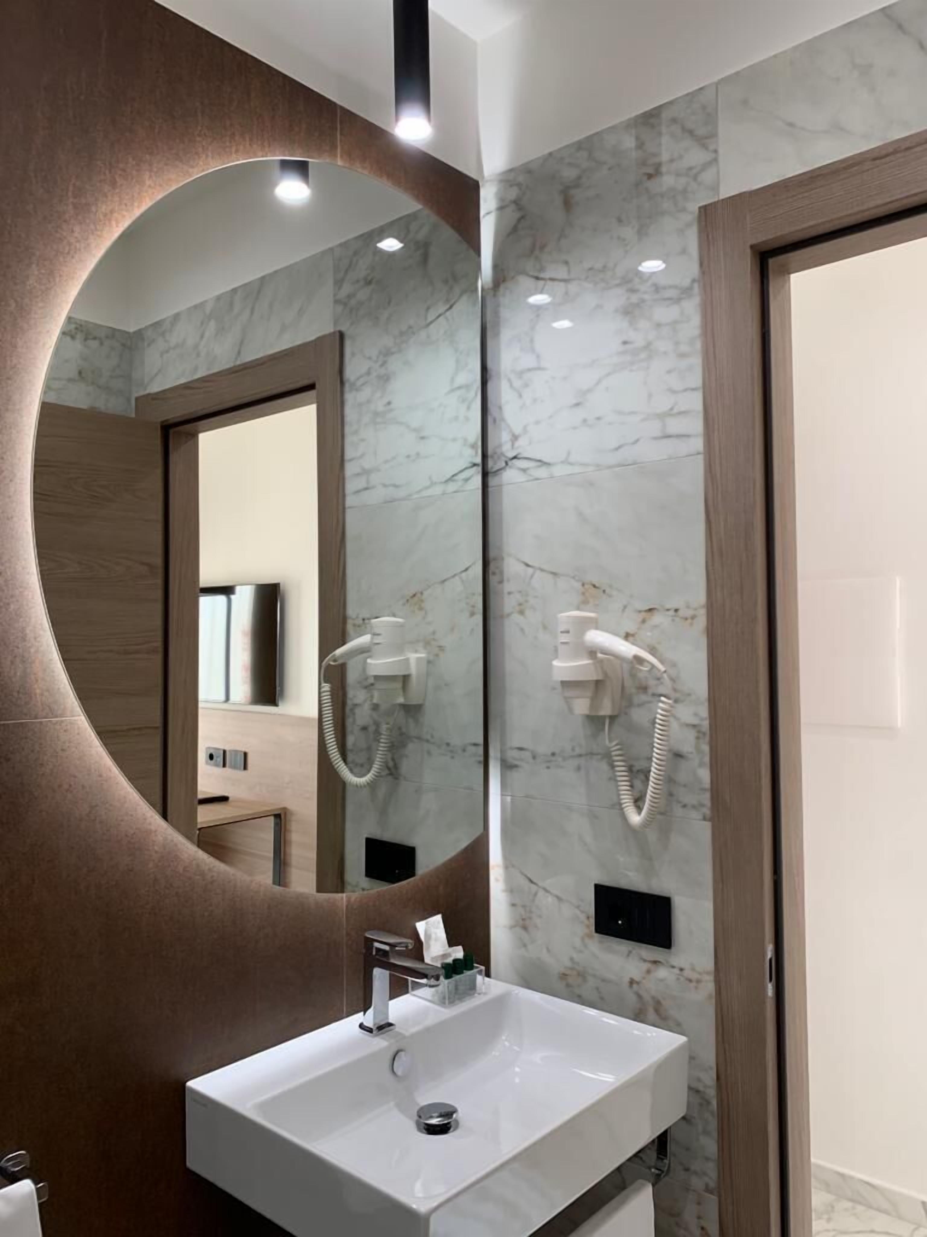 shower, hair dryer, bathrobes, slippers