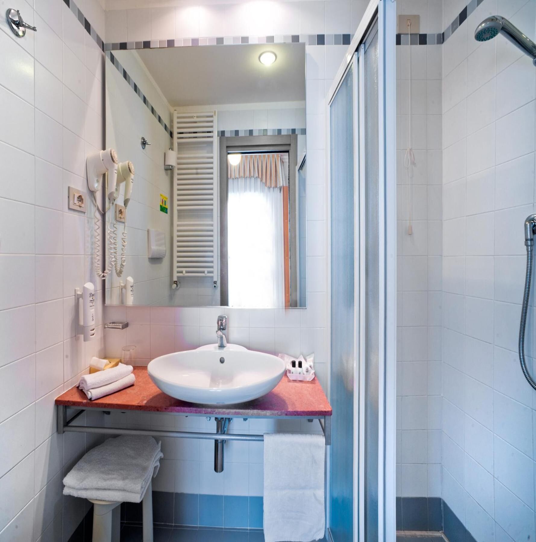 shower, free toiletries, hair dryer, towels