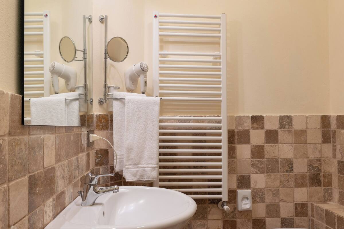 superior double room | bathroom | shower, hair dryer, bidet, towels