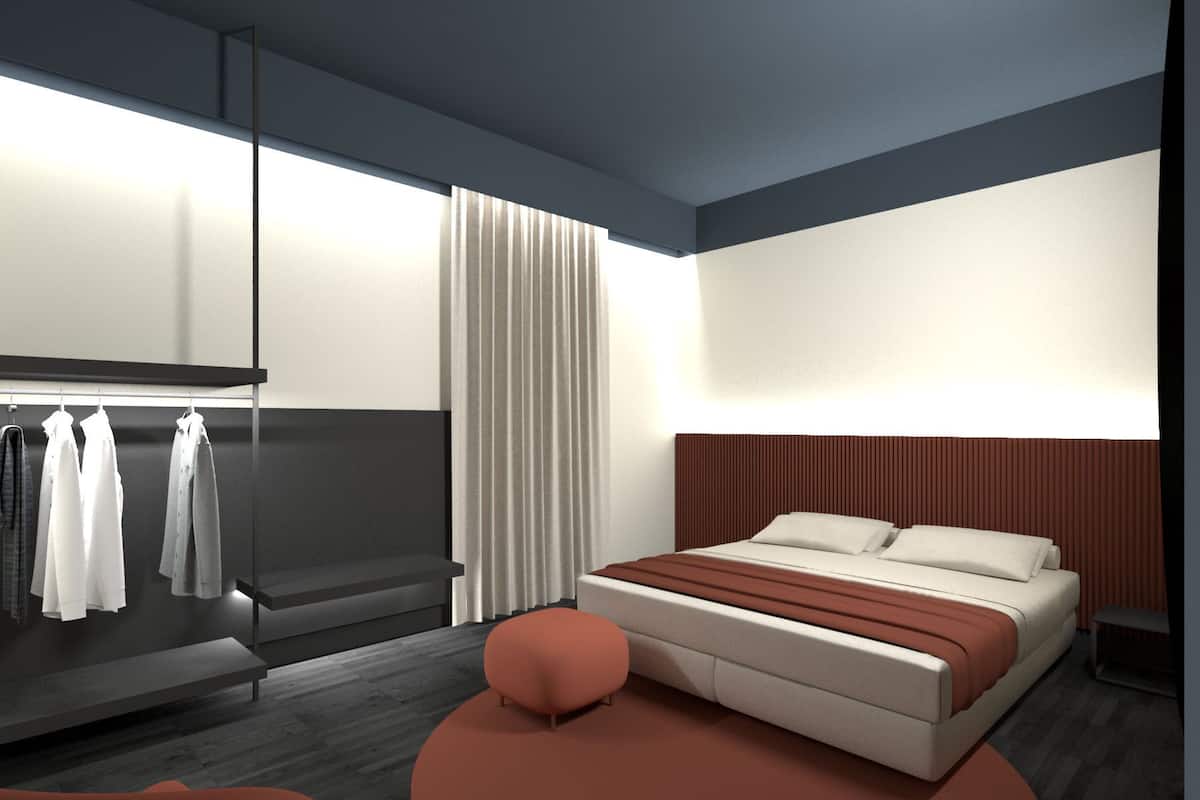 A modern bedroom with a bed, a bench, and a clothing rack.
