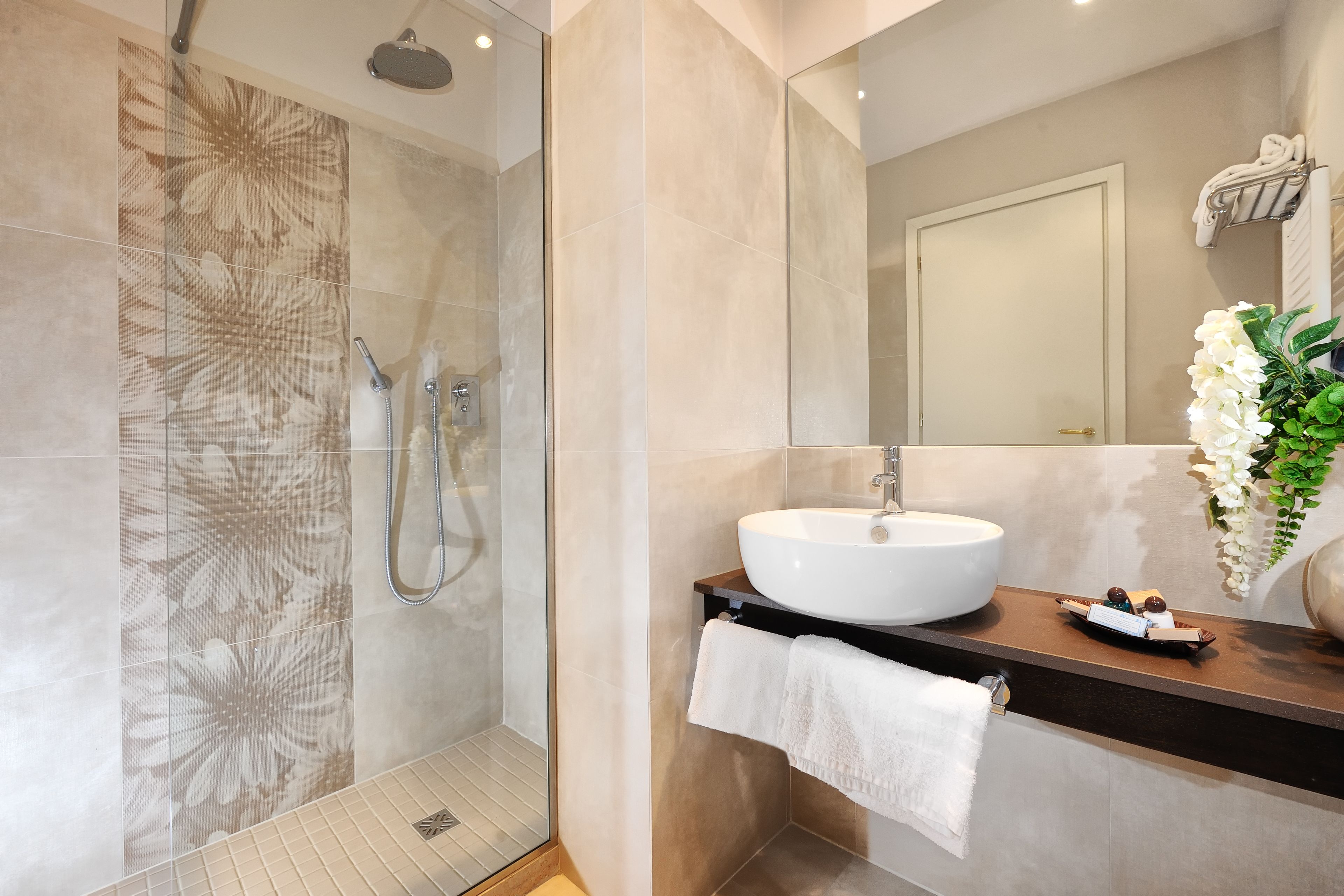 rainfall showerhead, hair dryer, bidet, towels