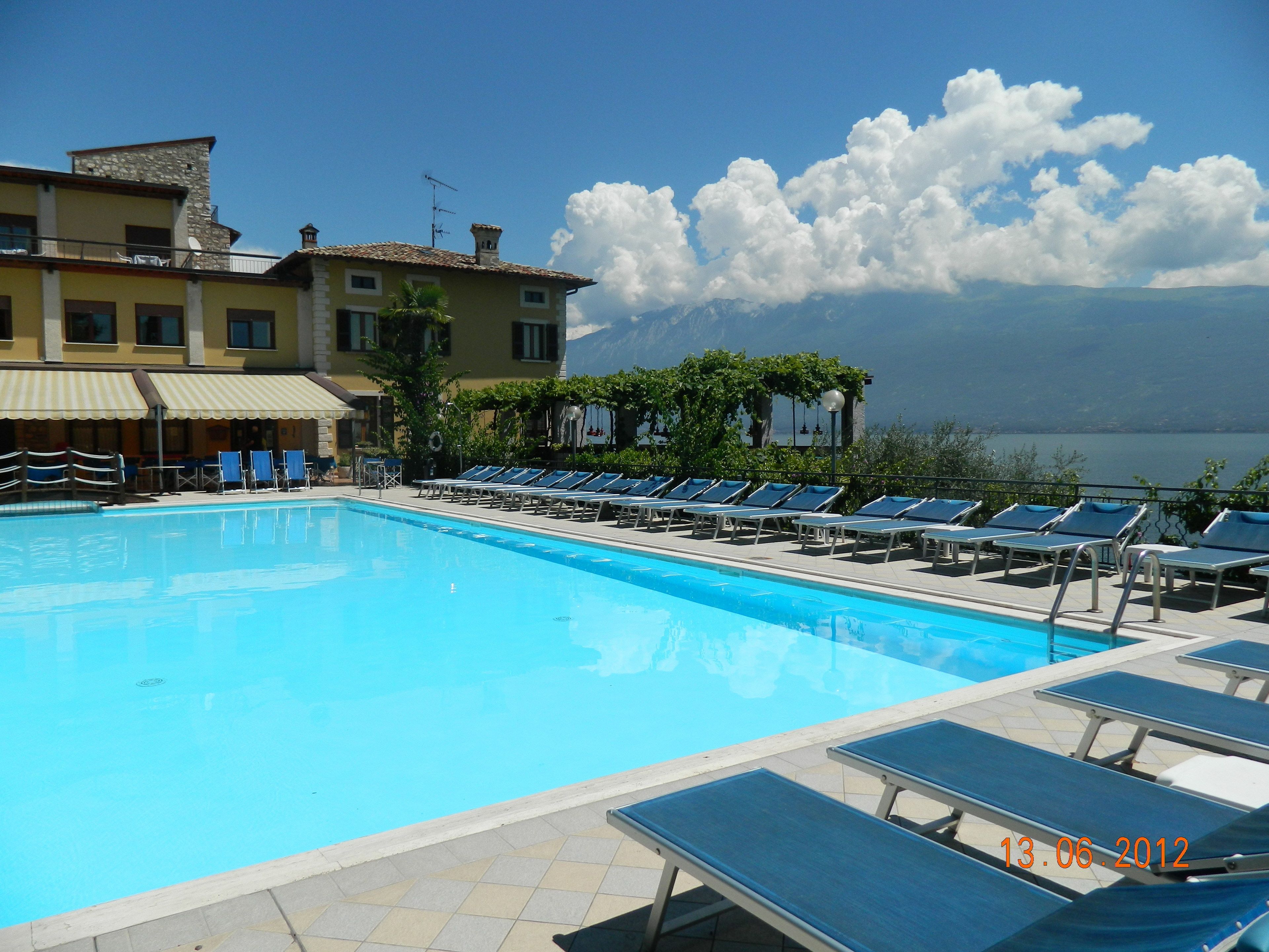 2 outdoor pools, open 7 am to 8 pm, pool loungers