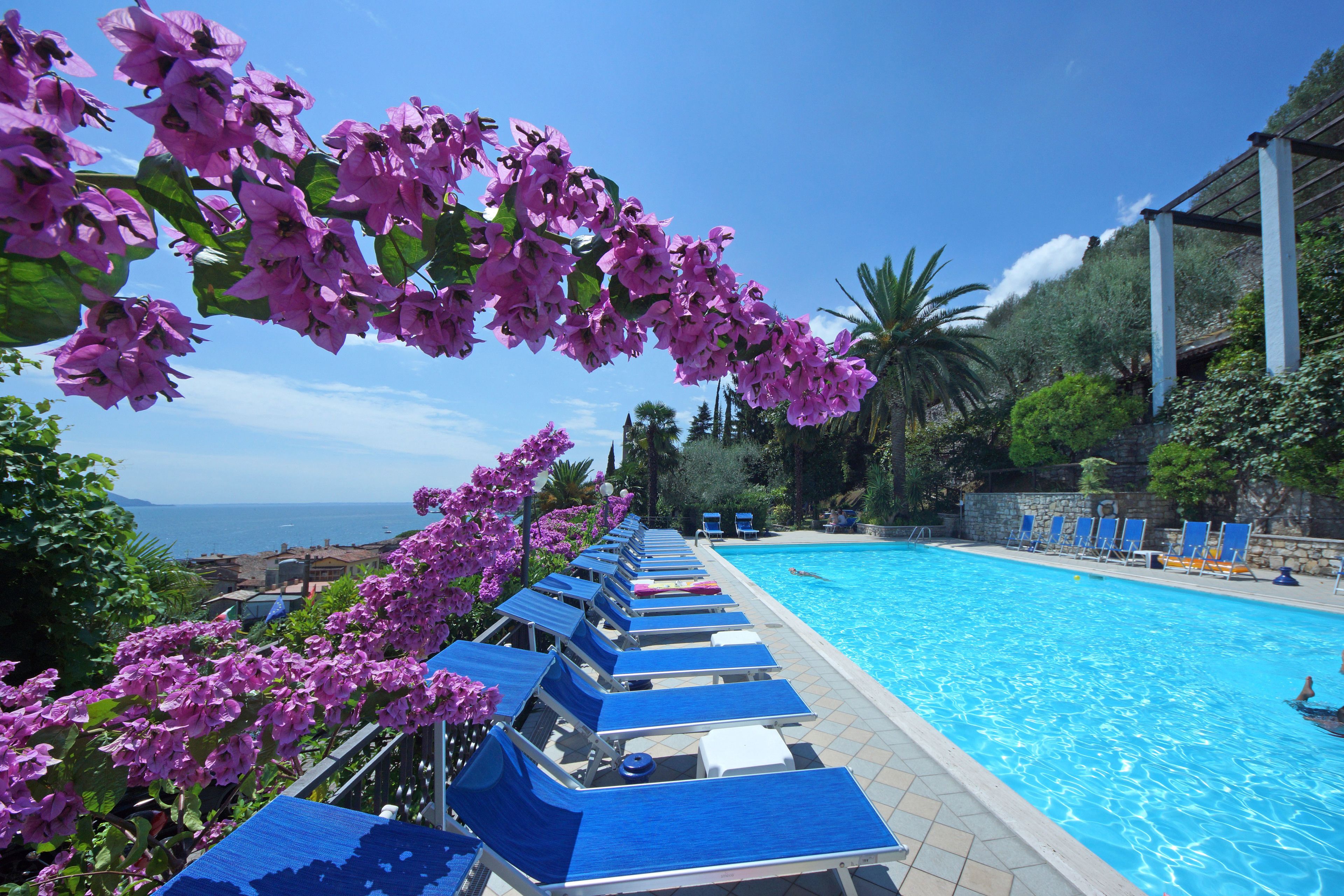 2 outdoor pools, open 7 am to 8 pm, pool loungers