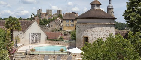 Outdoor pool, open 10:00 AM to 8:00 PM, pool umbrellas, pool loungers