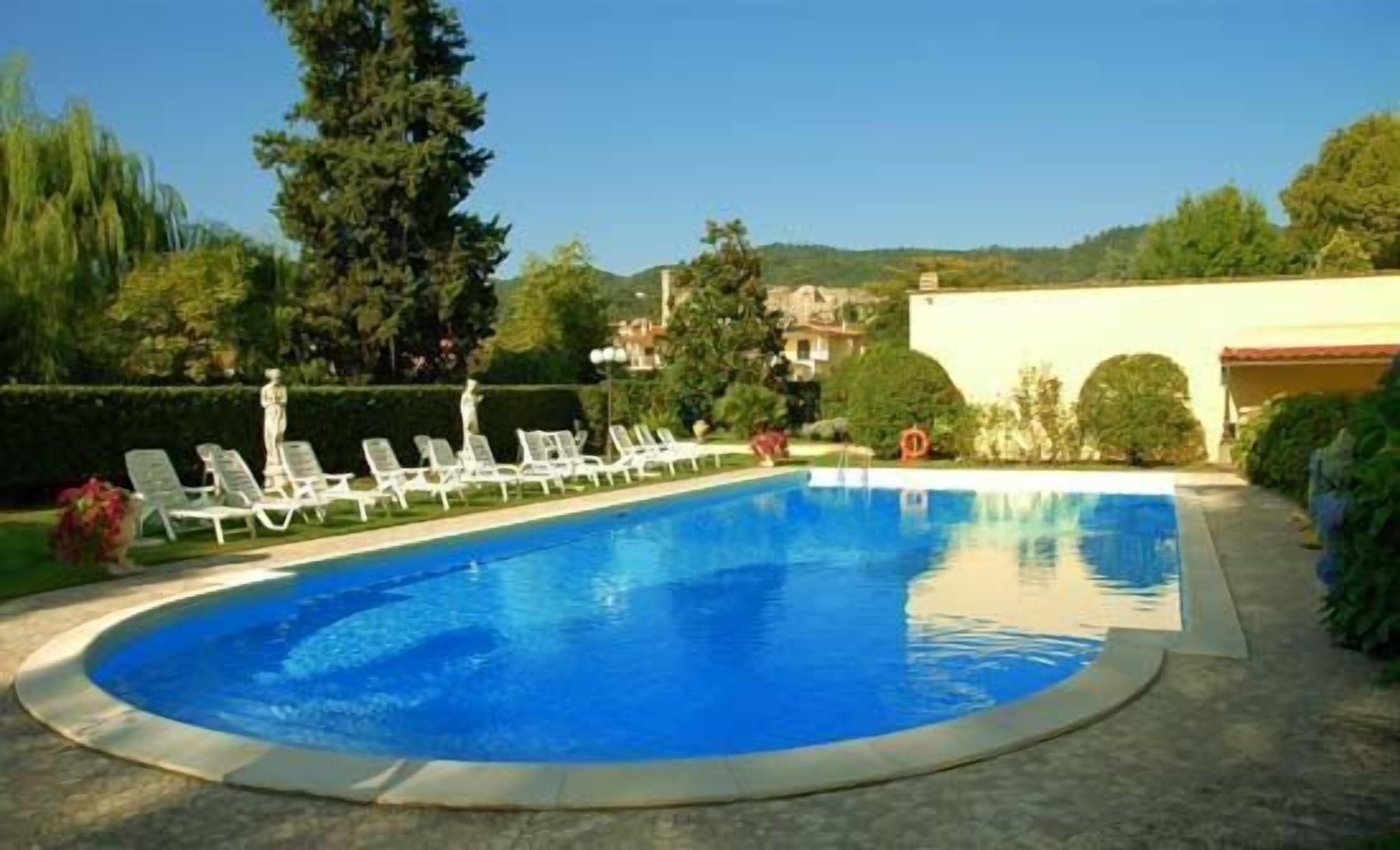 seasonal outdoor pool, pool umbrellas, pool loungers