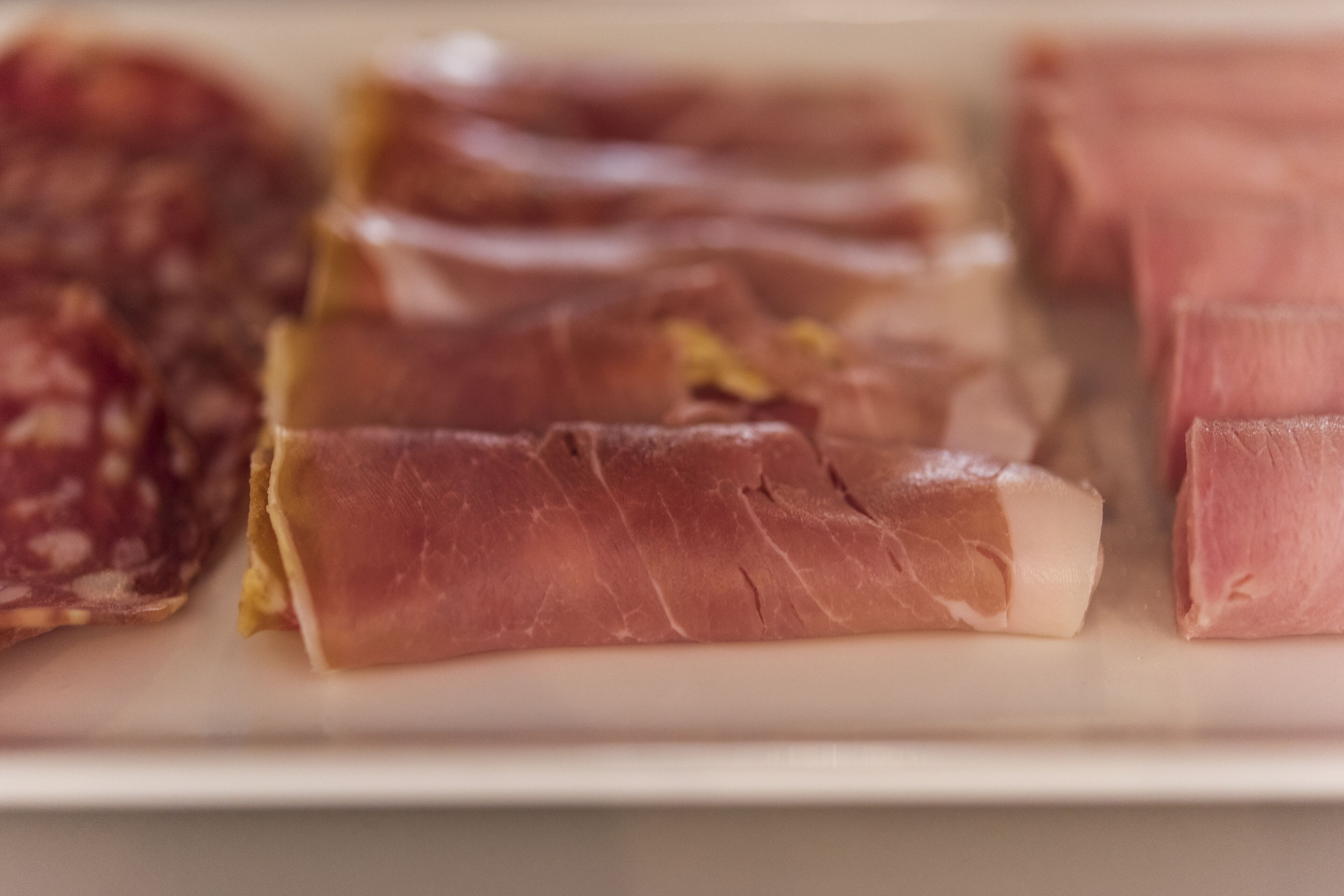 A plate with various types of cured meats.