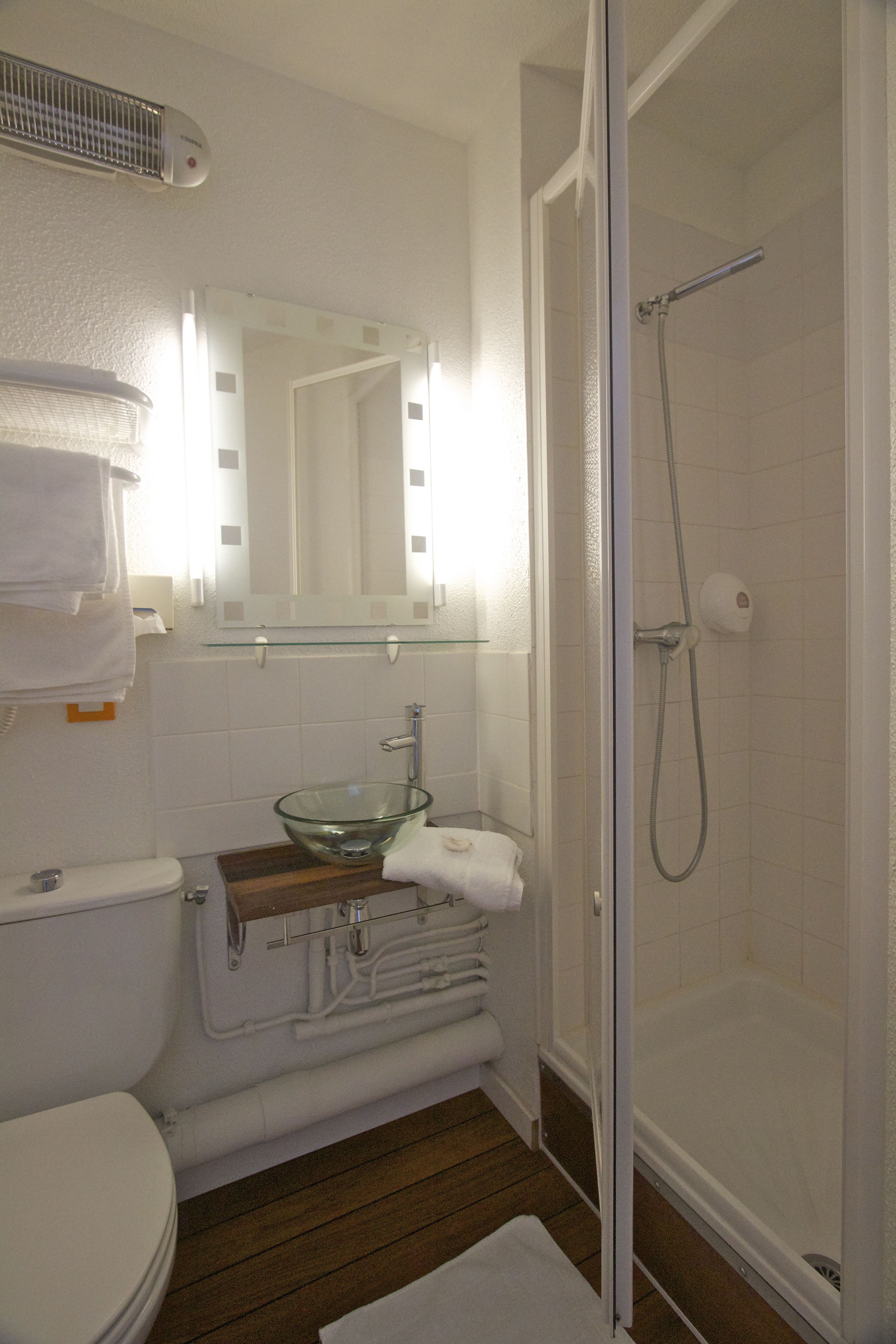 economy double room | bathroom | hair dryer, towels, soap, shampoo