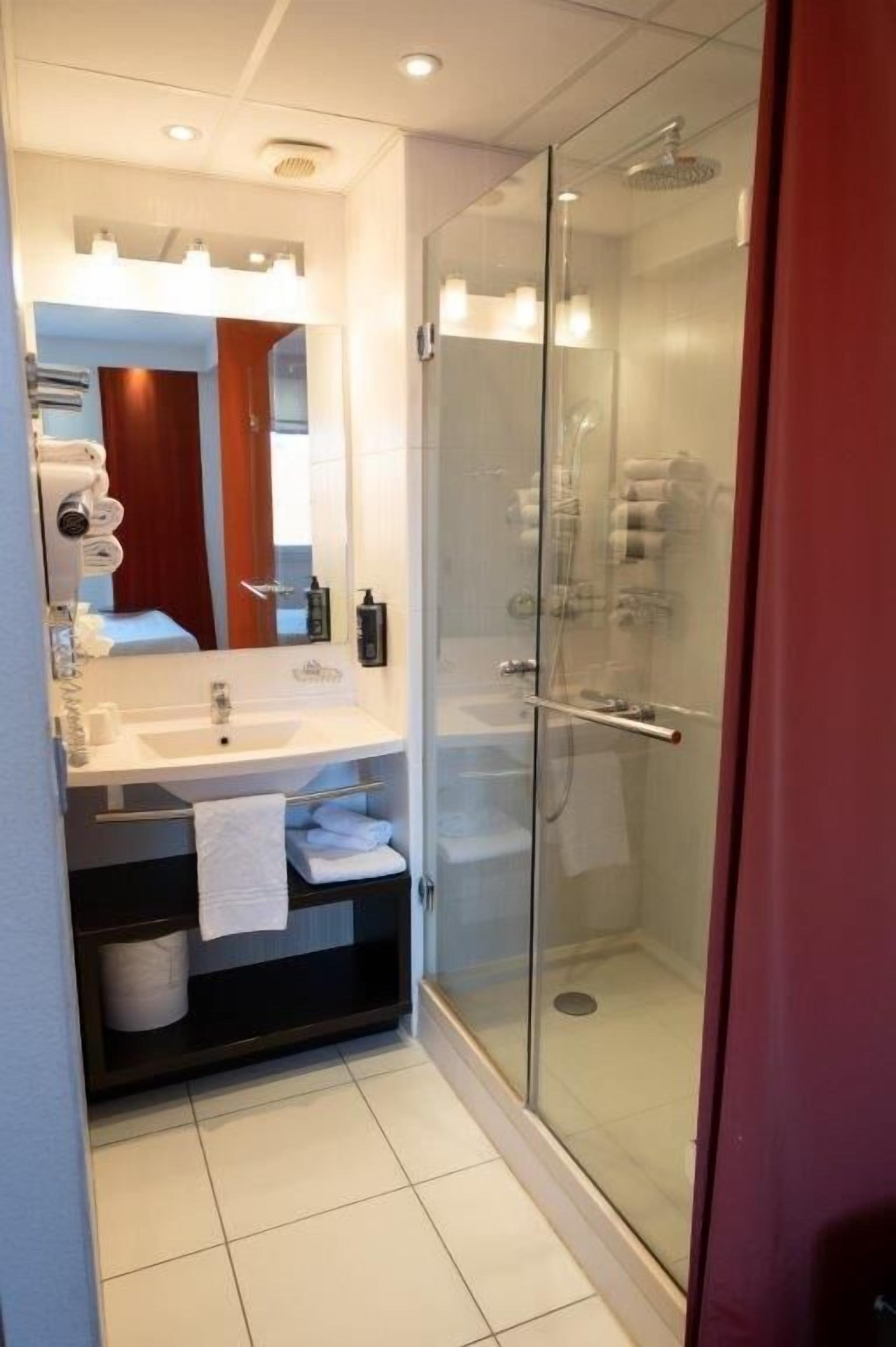 standard suite, multiple beds | bathroom | eco-friendly toiletries, hair dryer, towels, soap