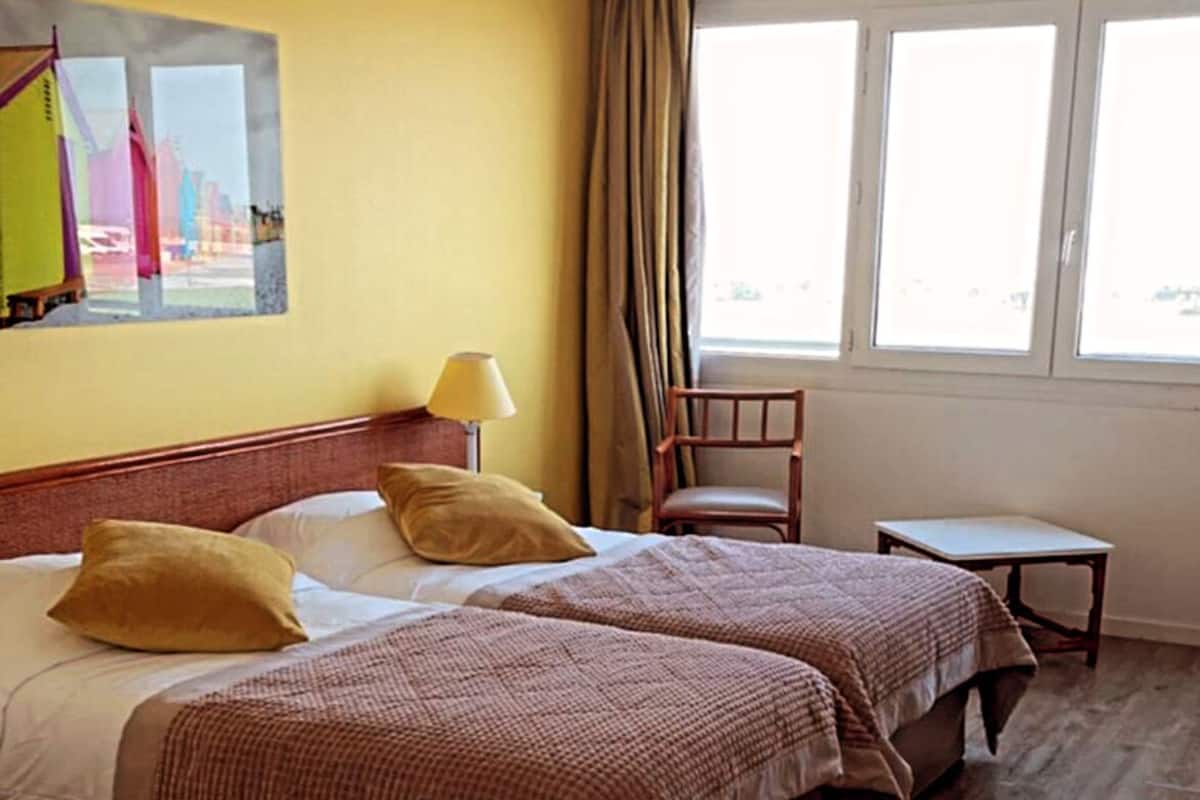 Premium bedding, desk, blackout curtains, soundproofing
