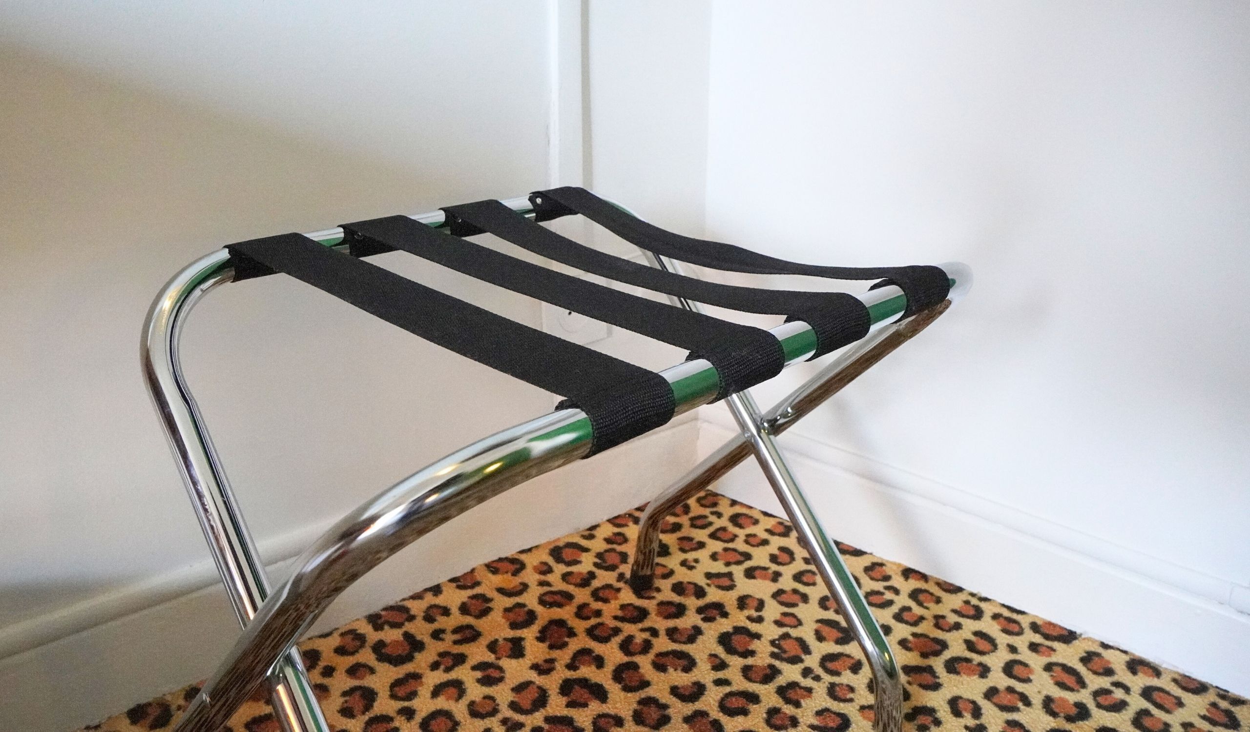 A chair with a metal frame and black fabric seat.