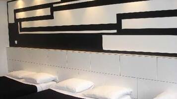 Vierbettzimmer | Hochwertige Bettwaren, individuell dekoriert, individuell eingerichtet