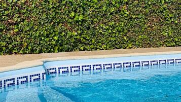 Seasonal outdoor pool, open 9 AM to 9 PM, pool umbrellas, sun loungers