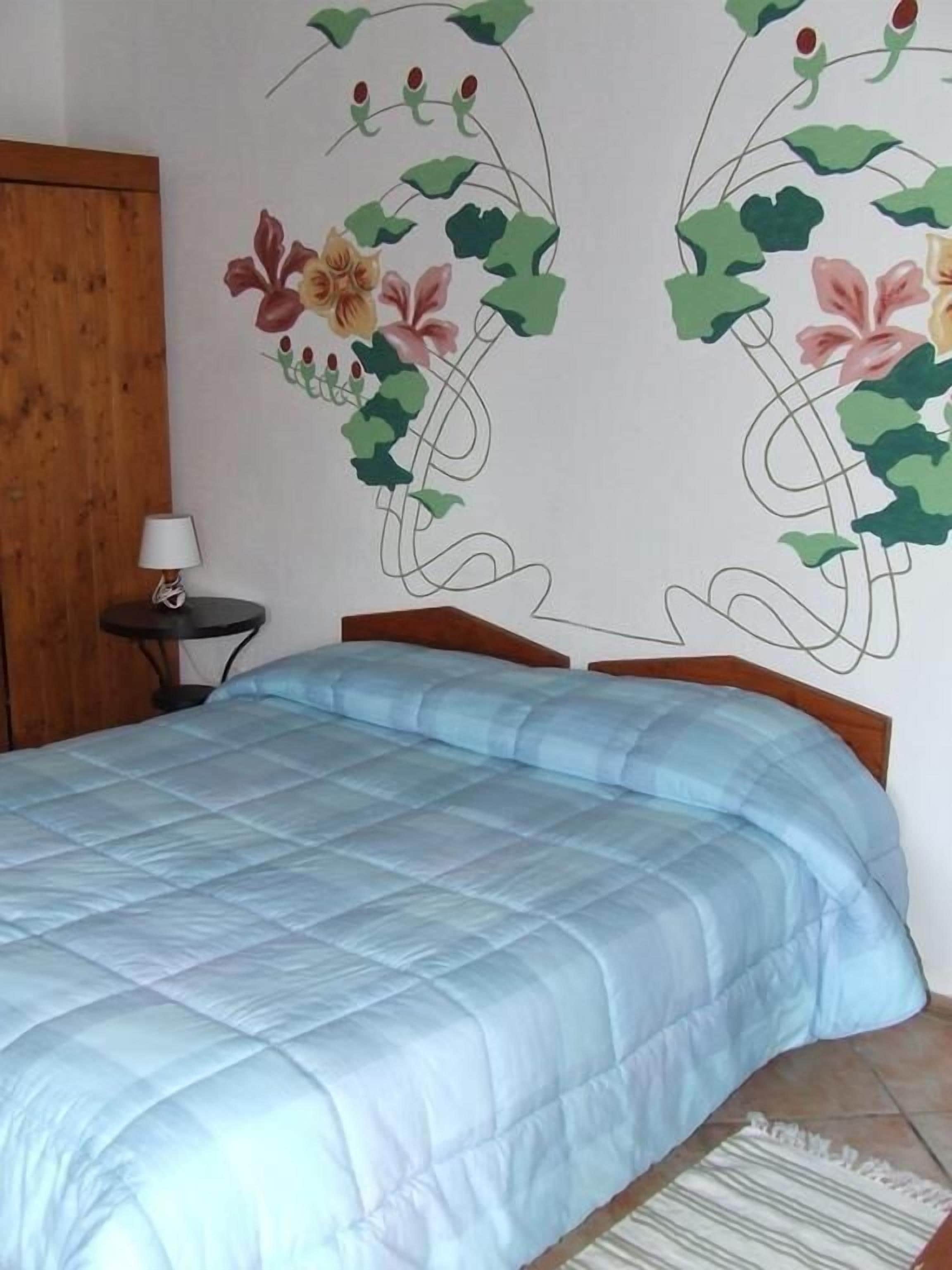 Desk, blackout drapes, bed sheets