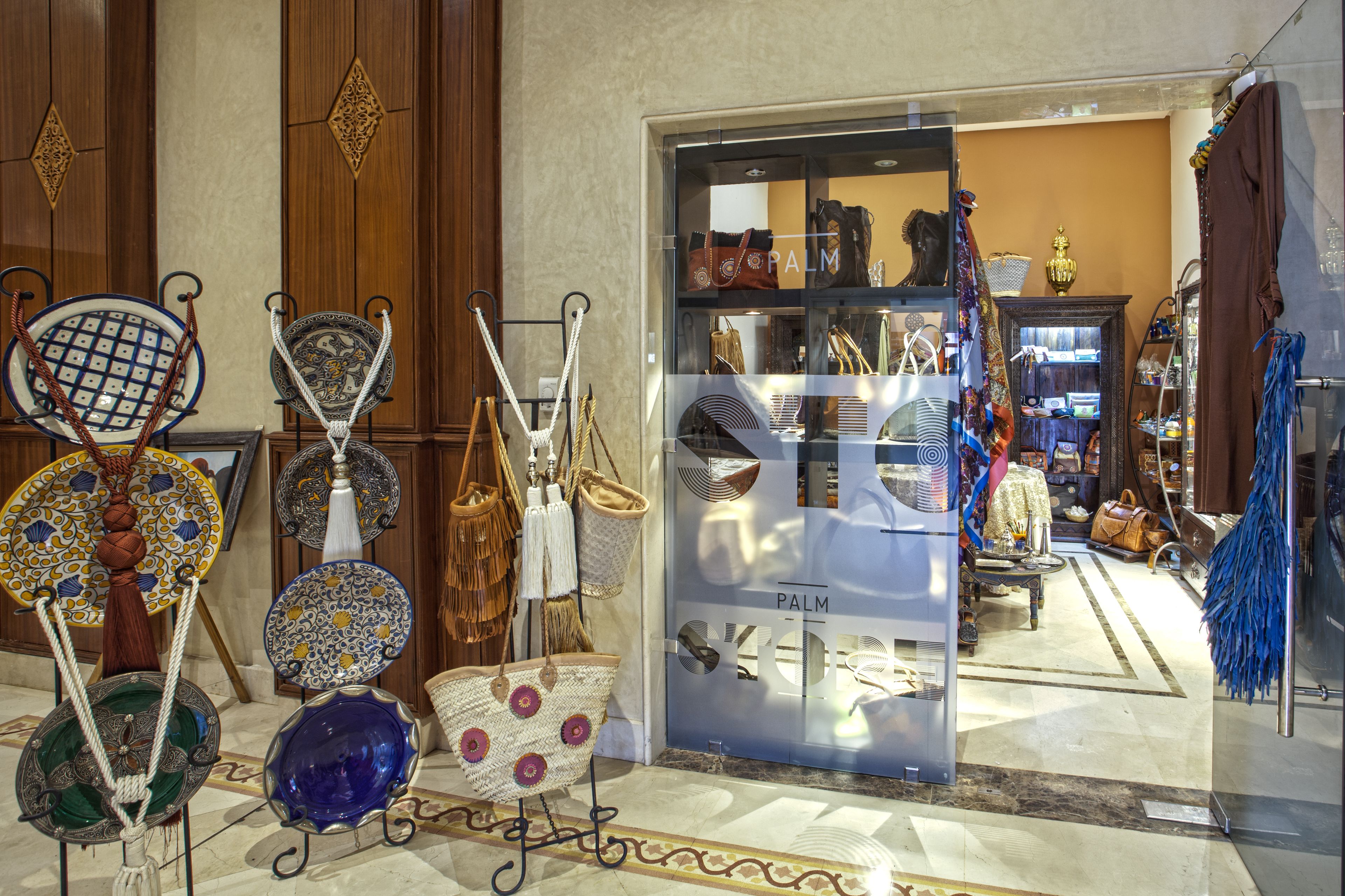 A store with a variety of bags and accessories displayed in the window.
