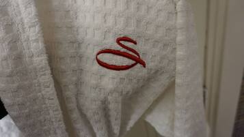 A white towel with a red embroidered letter 'S'.