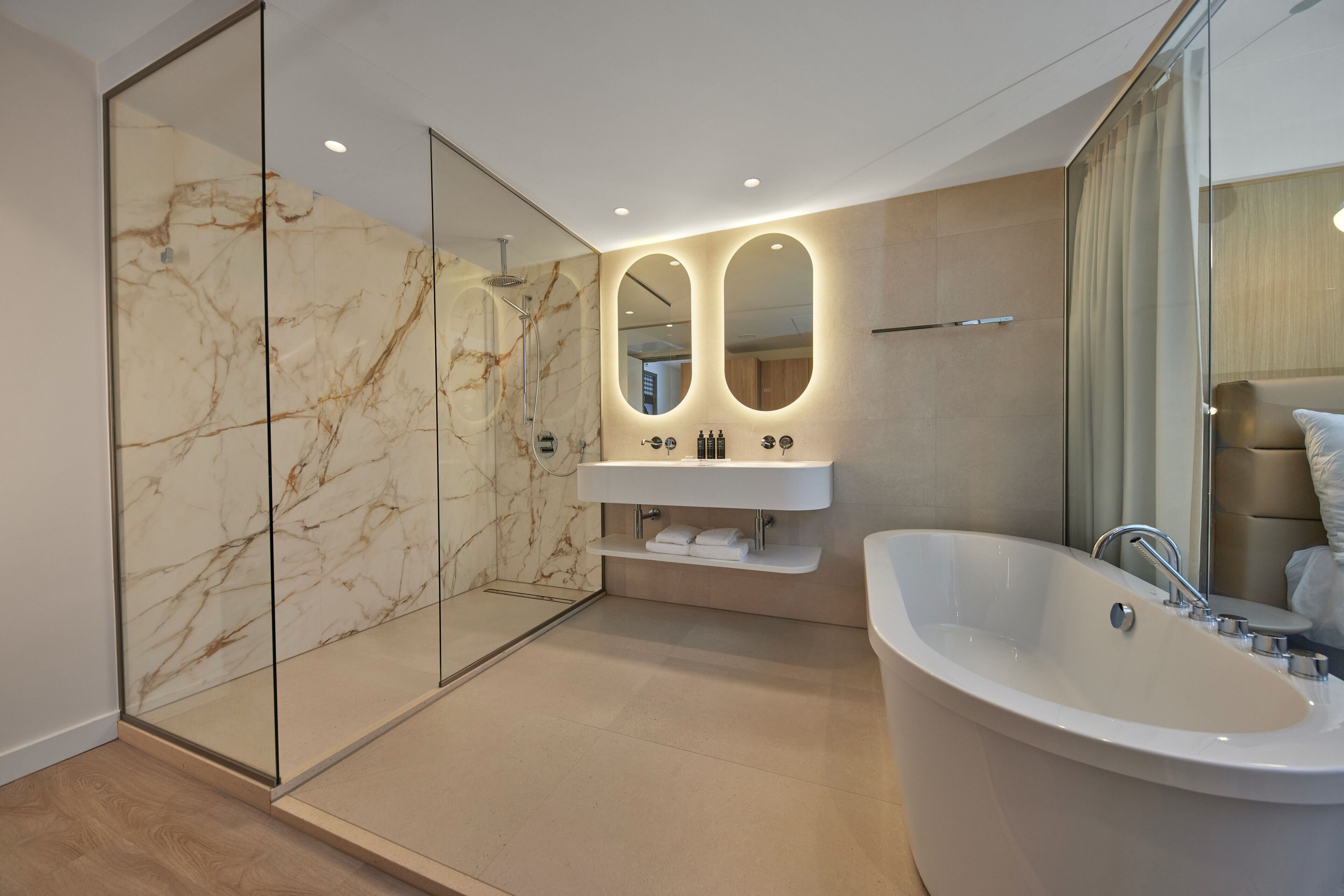 superior suite, 1 king bed | bathroom | separate bathtub and shower, deep-soaking bathtub, hair dryer, towels