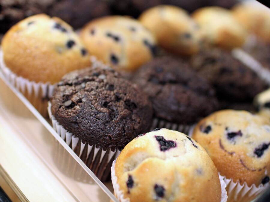 A tray of muffins in paper liners.
