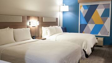 Premium bedding, pillowtop beds, laptop workspace, blackout drapes