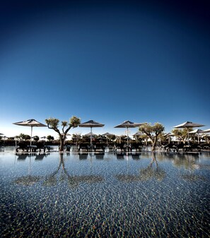 Indoor pool, outdoor pool, pool umbrellas, sun loungers