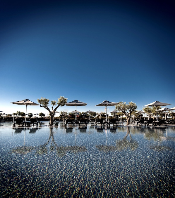 Indoor pool, outdoor pool, pool umbrellas, pool loungers