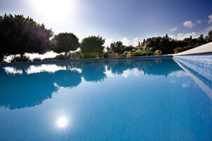 Seasonal outdoor pool, pool umbrellas, pool loungers