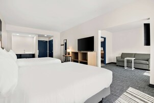 Room, 2 Queen Beds | Living area | 40-inch TV with cable channels, pay movies