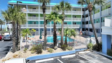 Outdoor pool, a heated pool, open 8 AM to 10 PM, pool umbrellas