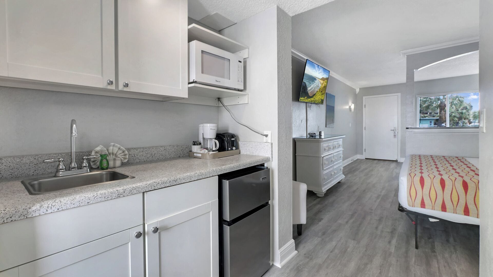 standard condo, multiple beds, kitchenette, pool view | private kitchenette | mini-fridge, microwave, coffee/tea maker, toaster