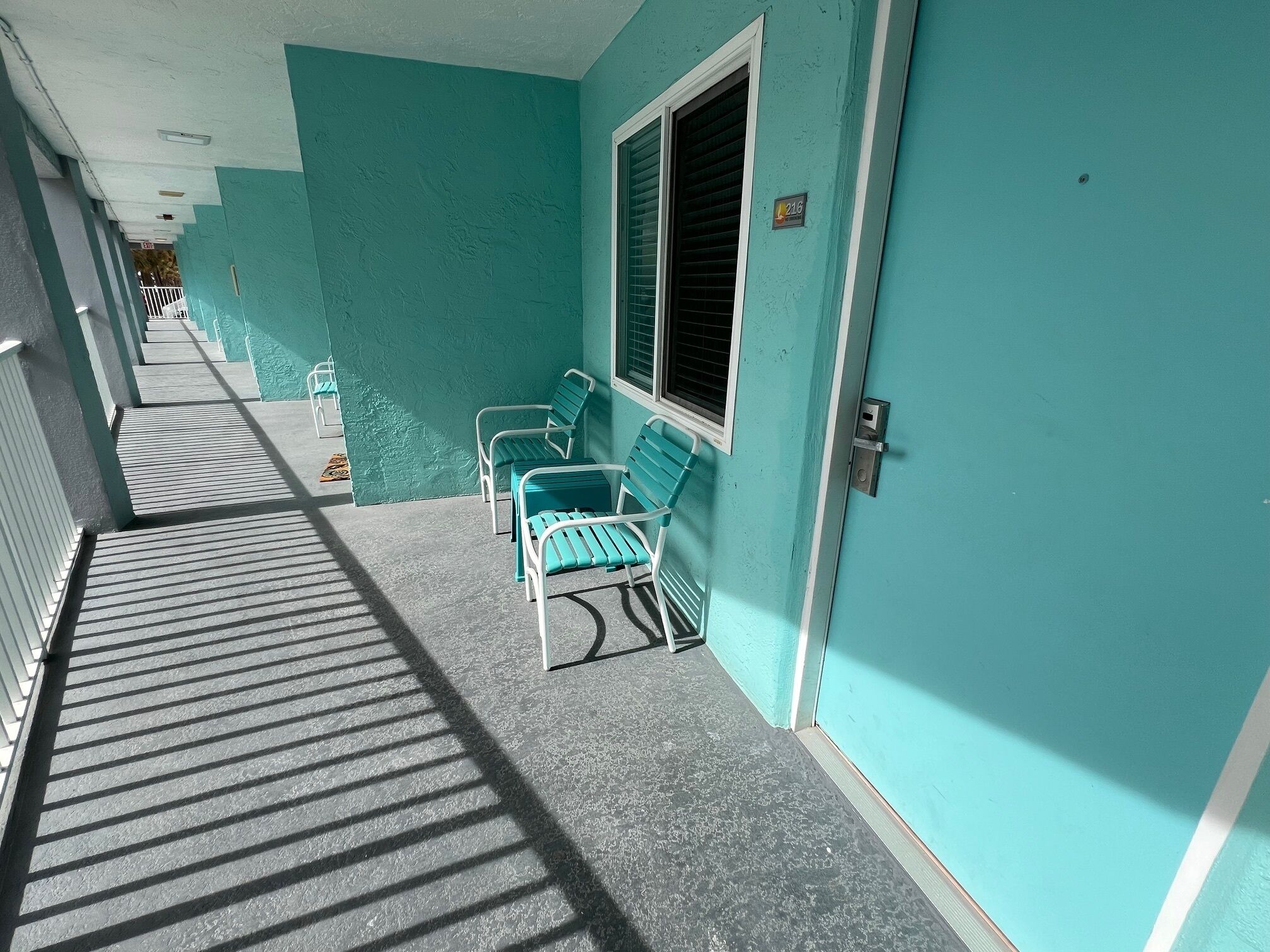 standard condo, multiple beds, kitchenette, pool view | property amenity