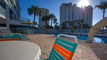 Outdoor pool, a heated pool, open 8 AM to 10 PM, pool umbrellas