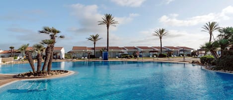 Outdoor pool, open 8:00 AM to 8:00 PM, pool umbrellas, pool loungers