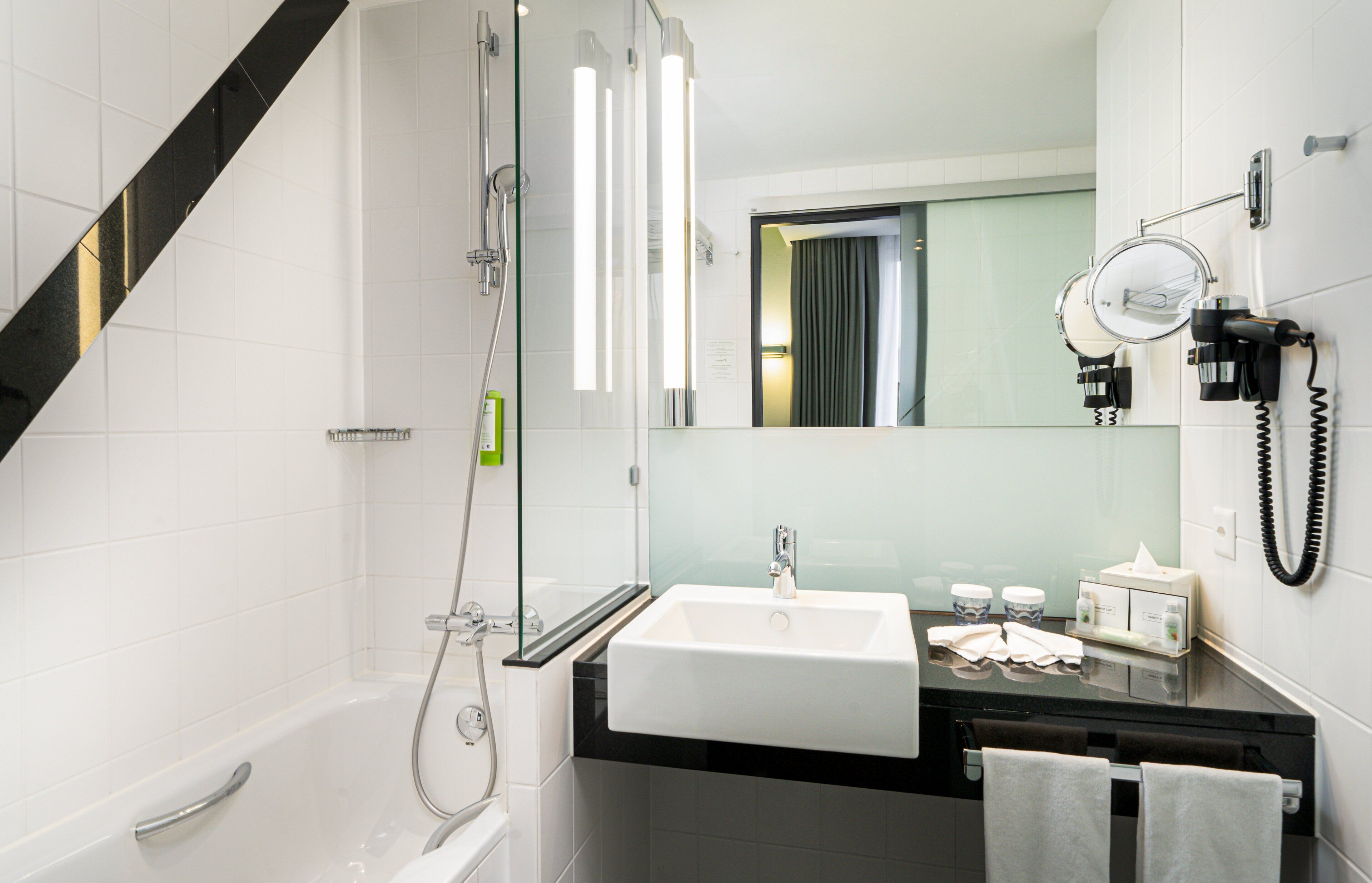 combined shower/bathtub, free toiletries, hair dryer, slippers