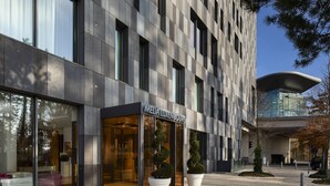 A modern building with a storefront labeled "MELIA LUXEMBOURG."