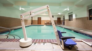 An indoor swimming pool with a diving board, a no diving sign, and a lifeguard chair. - Holiday Inn Express Hotel & Suites NEWPORT by IHG (Newport)