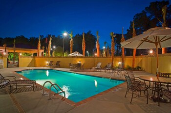 Outdoor pool, sun loungers at Hampton Inn & Suites North Charleston-University Blvd